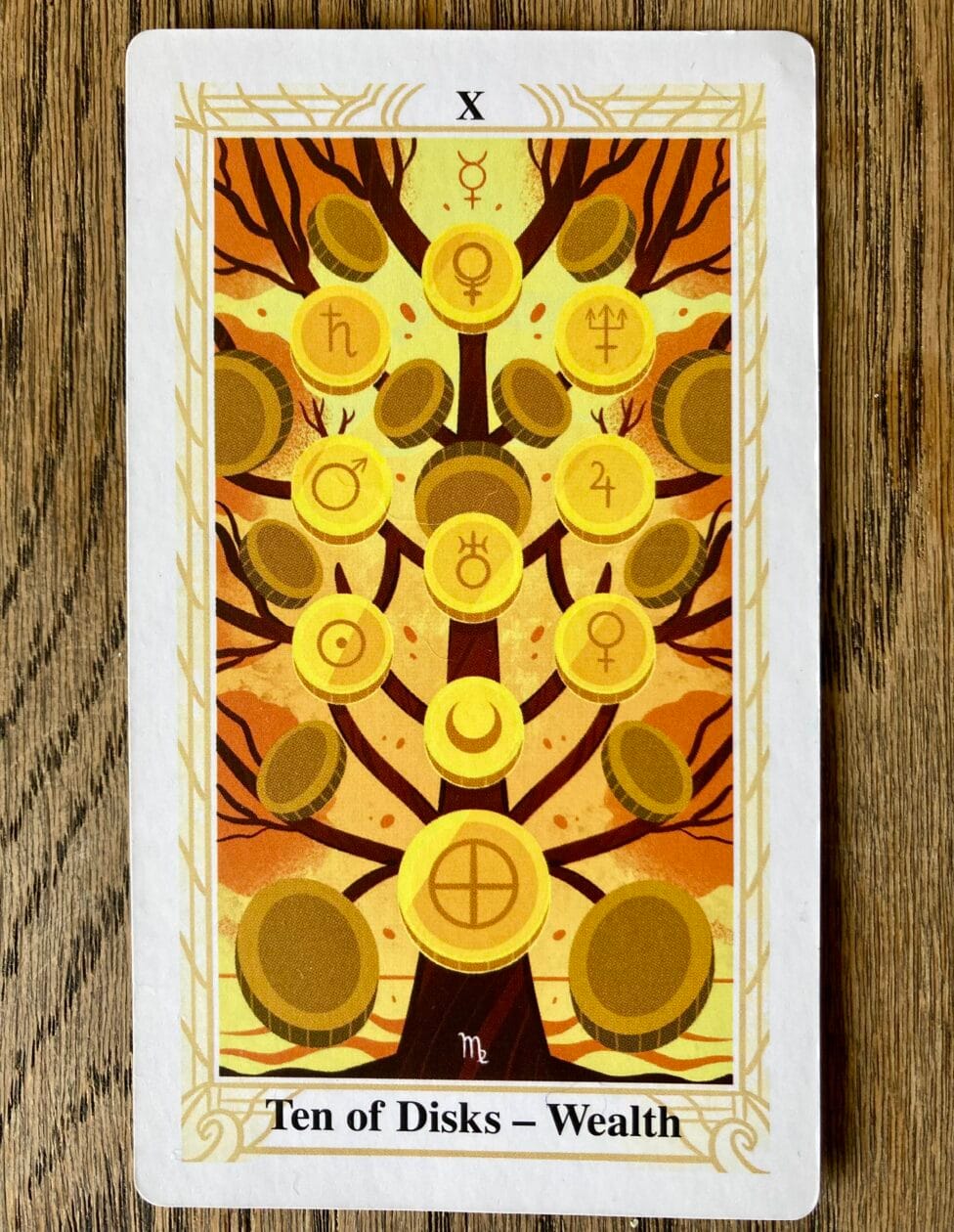 The Thoth 10 of Disks card, bold and vibrant, representing wealth, structure, and emotional containment.